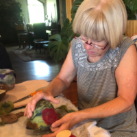 Woman working on wet felting