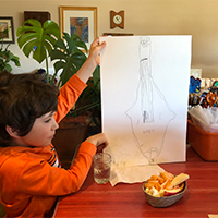 boy showing his drawing